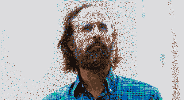 David Berman wearing a blue shirt
