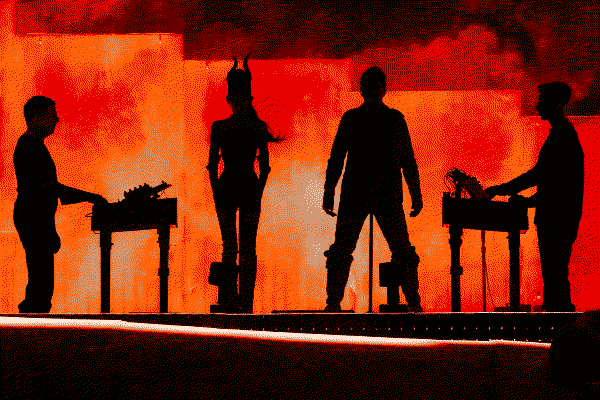 Atticus Ross, Mariqueen Maandig, Trent Reznor and Boys Noize silhouetted on stage during their Coachella set